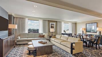 Luxury Suite | Living area | 37-inch LCD TV with cable channels, pay movies
