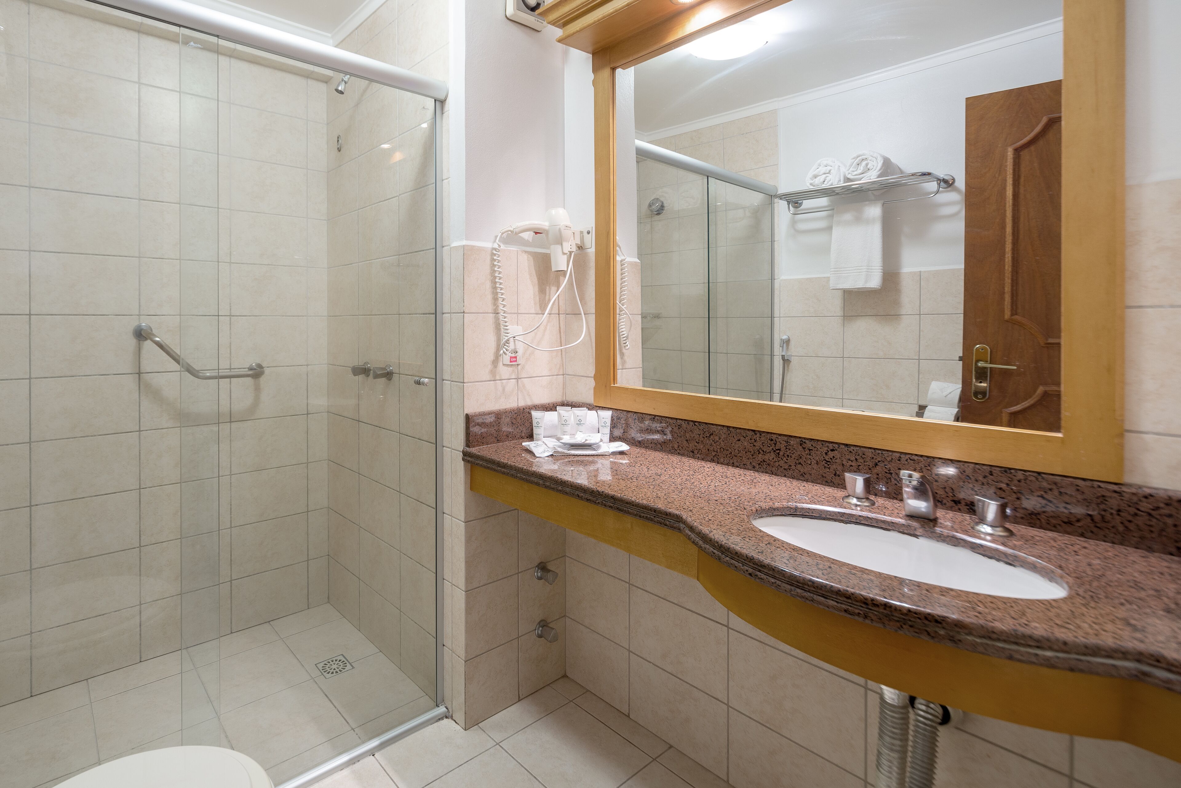 shower, rainfall showerhead, hair dryer, towels