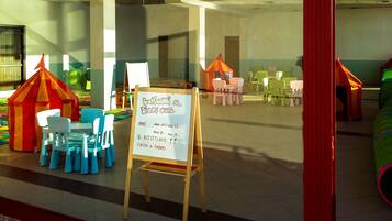 Children can play and learn in this interactive space with play structures and seating areas.