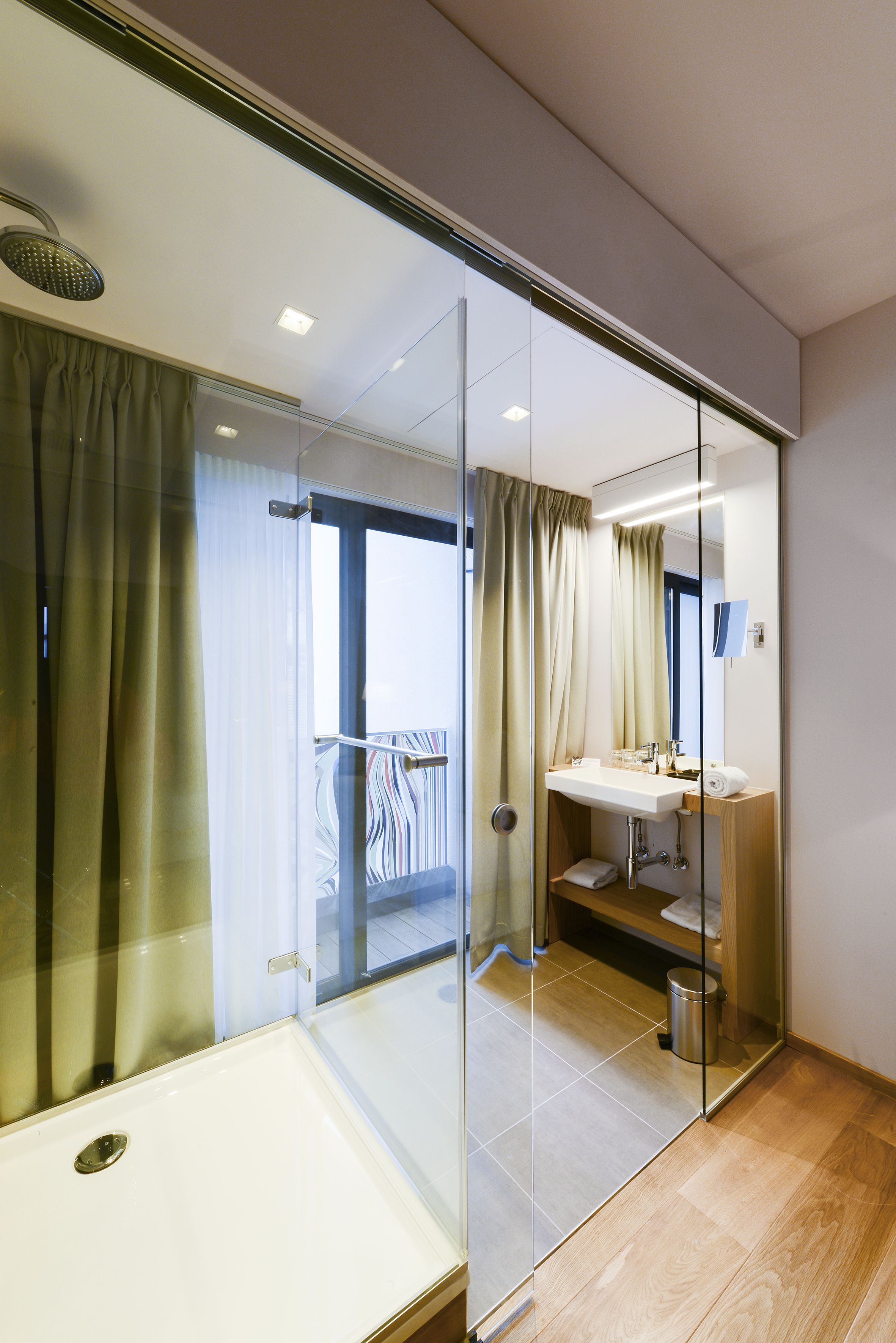 rainfall showerhead, designer toiletries, hair dryer, slippers