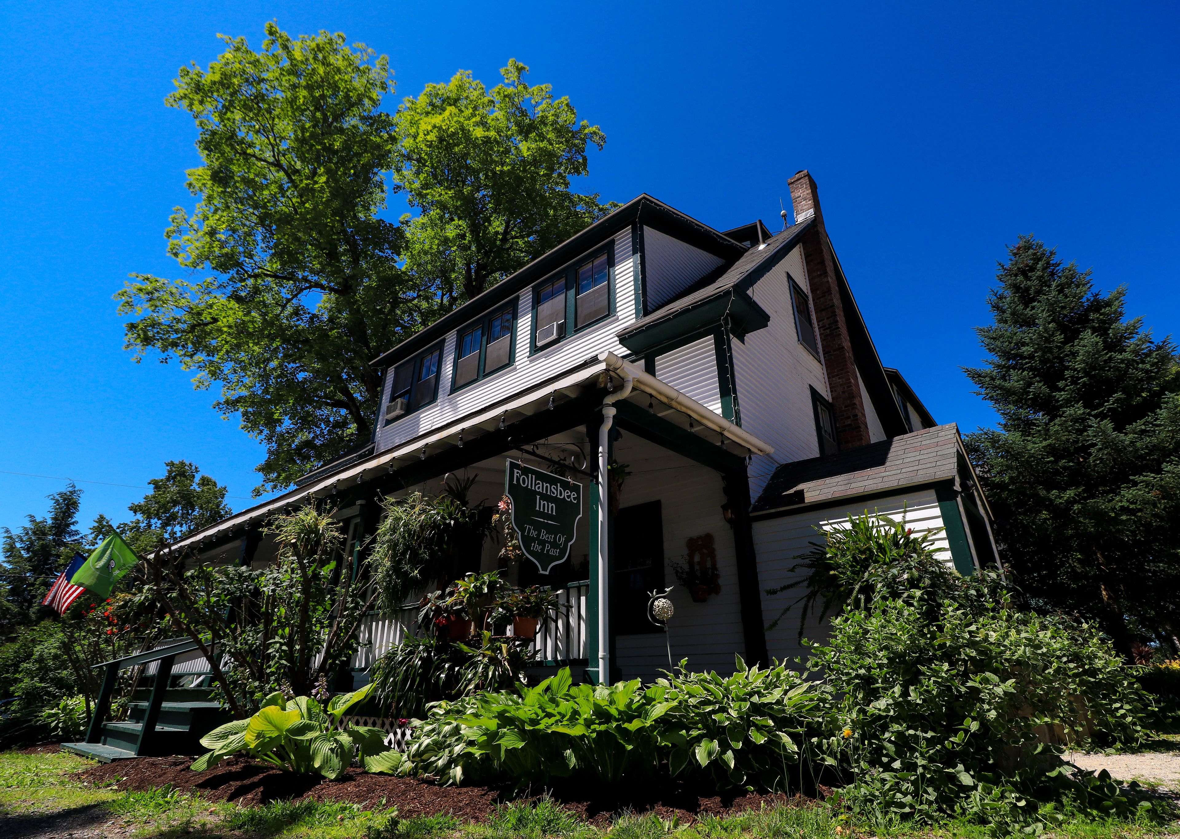 A two-story building with a sign reading "Follansbee Inn."