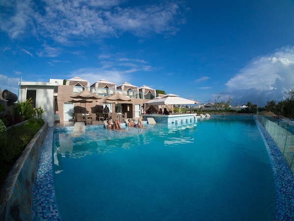 2 outdoor pools, pool umbrellas, pool loungers