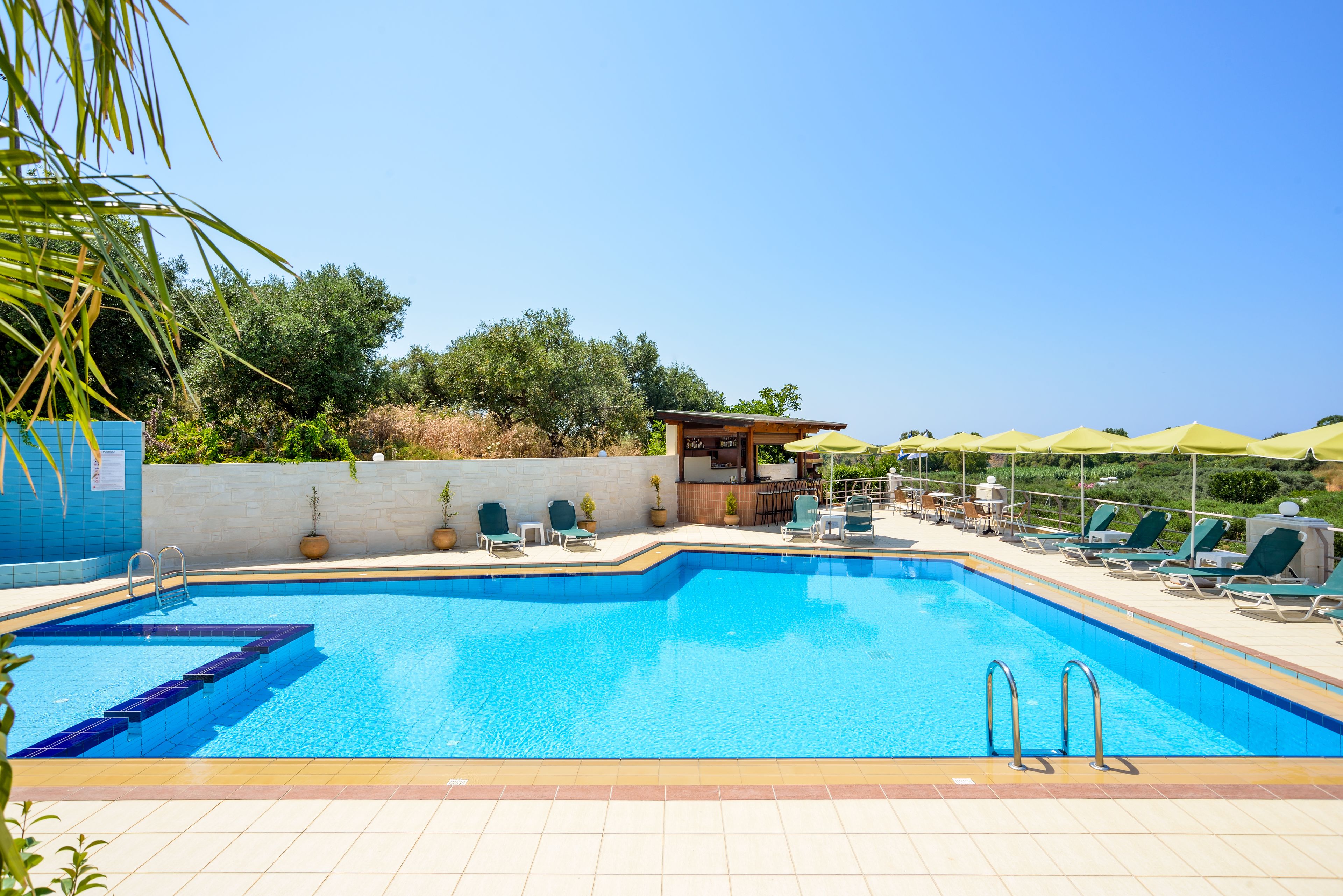 Outdoor pool, open 10:00 AM to 7:00 PM, pool umbrellas, pool loungers