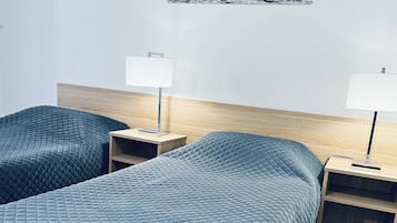 Suite, 2 Bedrooms | Desk, blackout drapes, iron/ironing board, free WiFi