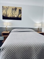 Deluxe Room, 1 Queen Bed | Desk, blackout drapes, iron/ironing board, free WiFi