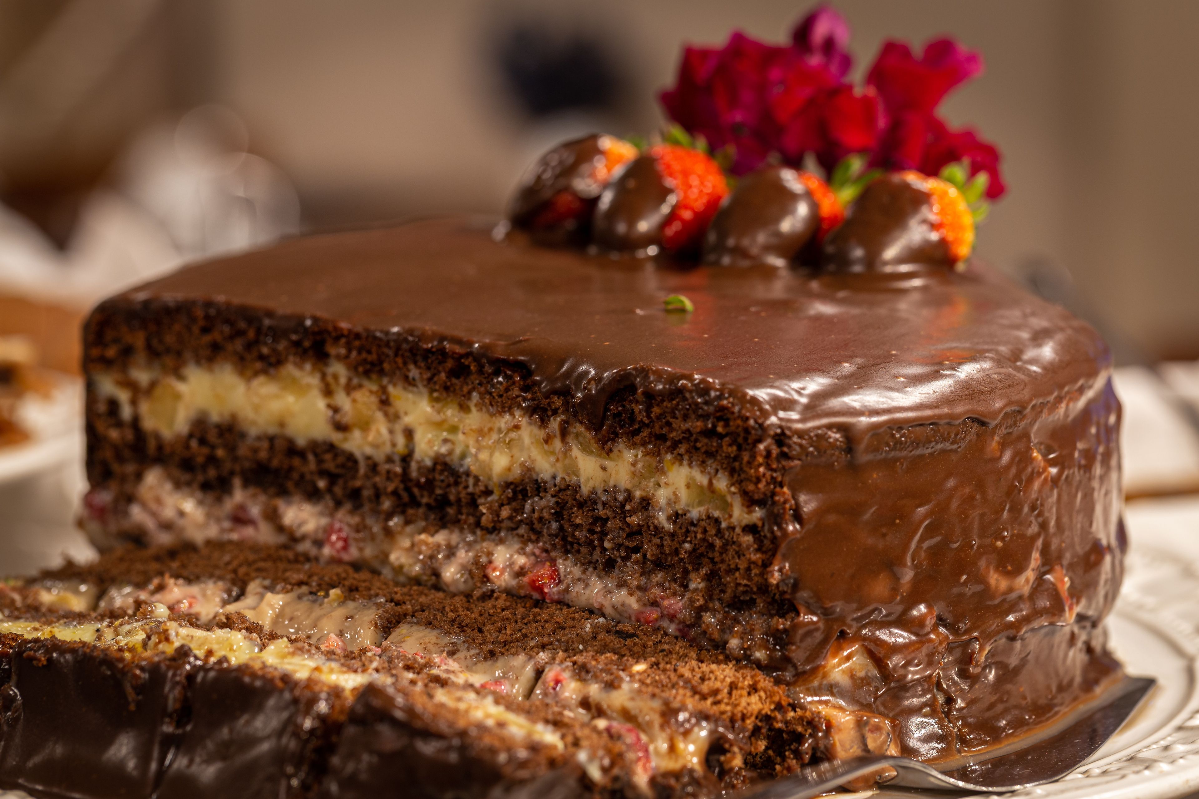 A chocolate cake with strawberries on top.