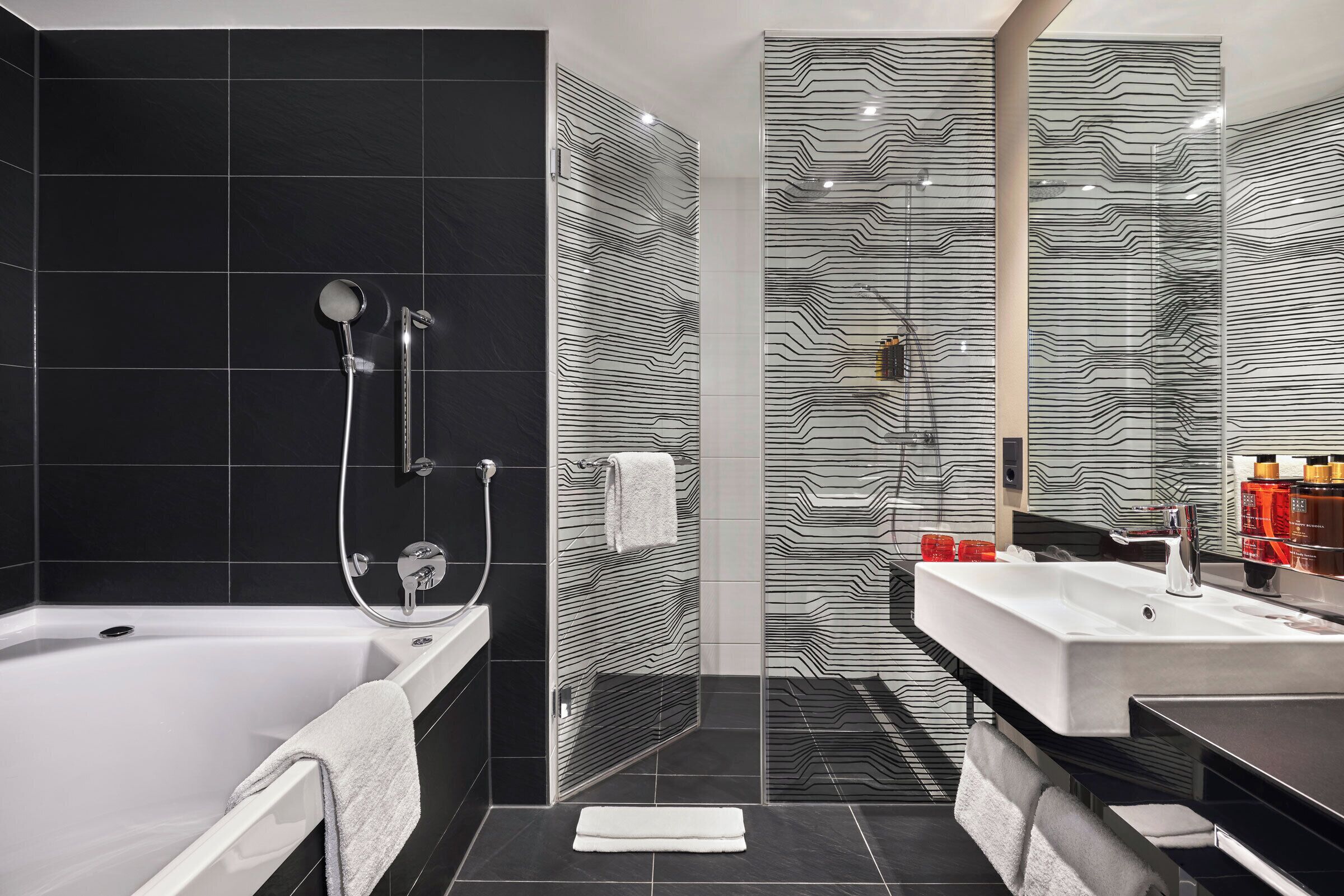 gallery double room | bathroom | rainfall showerhead, eco-friendly toiletries, hair dryer, towels