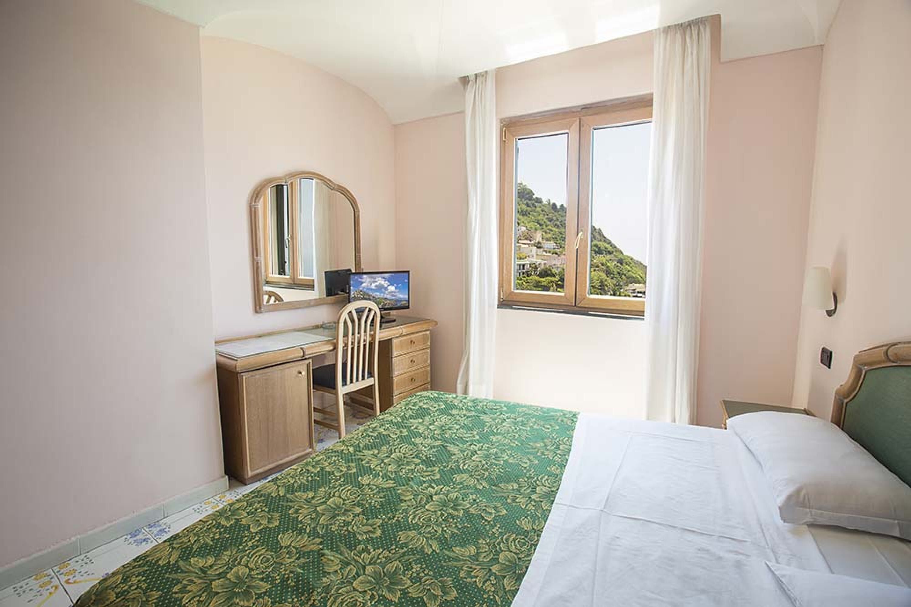 Standard Double Room | Minibar, in-room safe, desk, blackout curtains