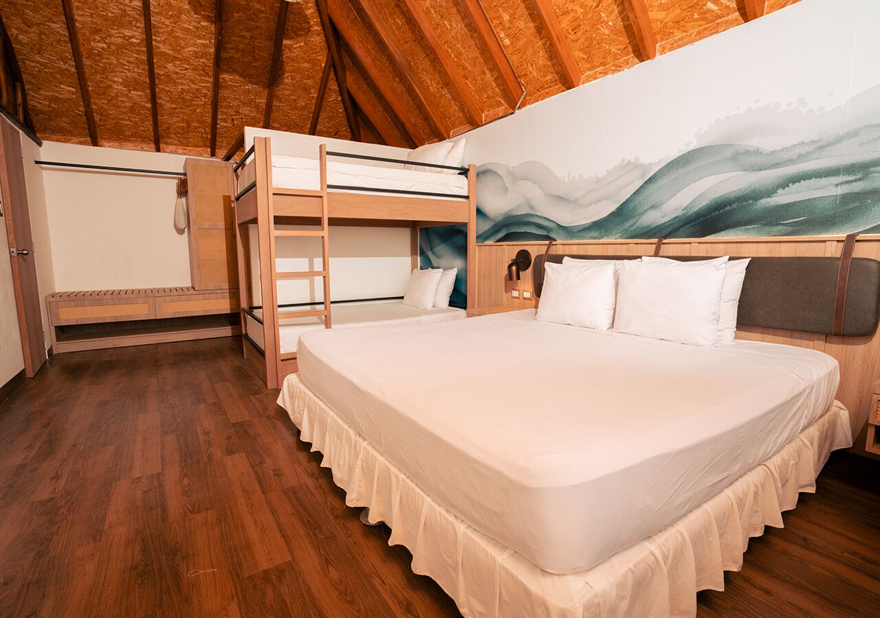 Familie bungalow, Meerdere bedden, uitzicht op tuin | Een minibar, een kluis op de kamer, gratis wifi, beddengoed