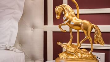A golden horse statue on a pedestal.