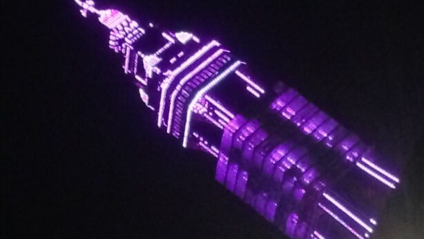A building with a prominent spire and illuminated structure. - Wilsons Hotel - Blackpool Tower View (Blackpool)