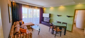 Family Apartment, Sea View | Minibar, in-room safe, desk, laptop workspace