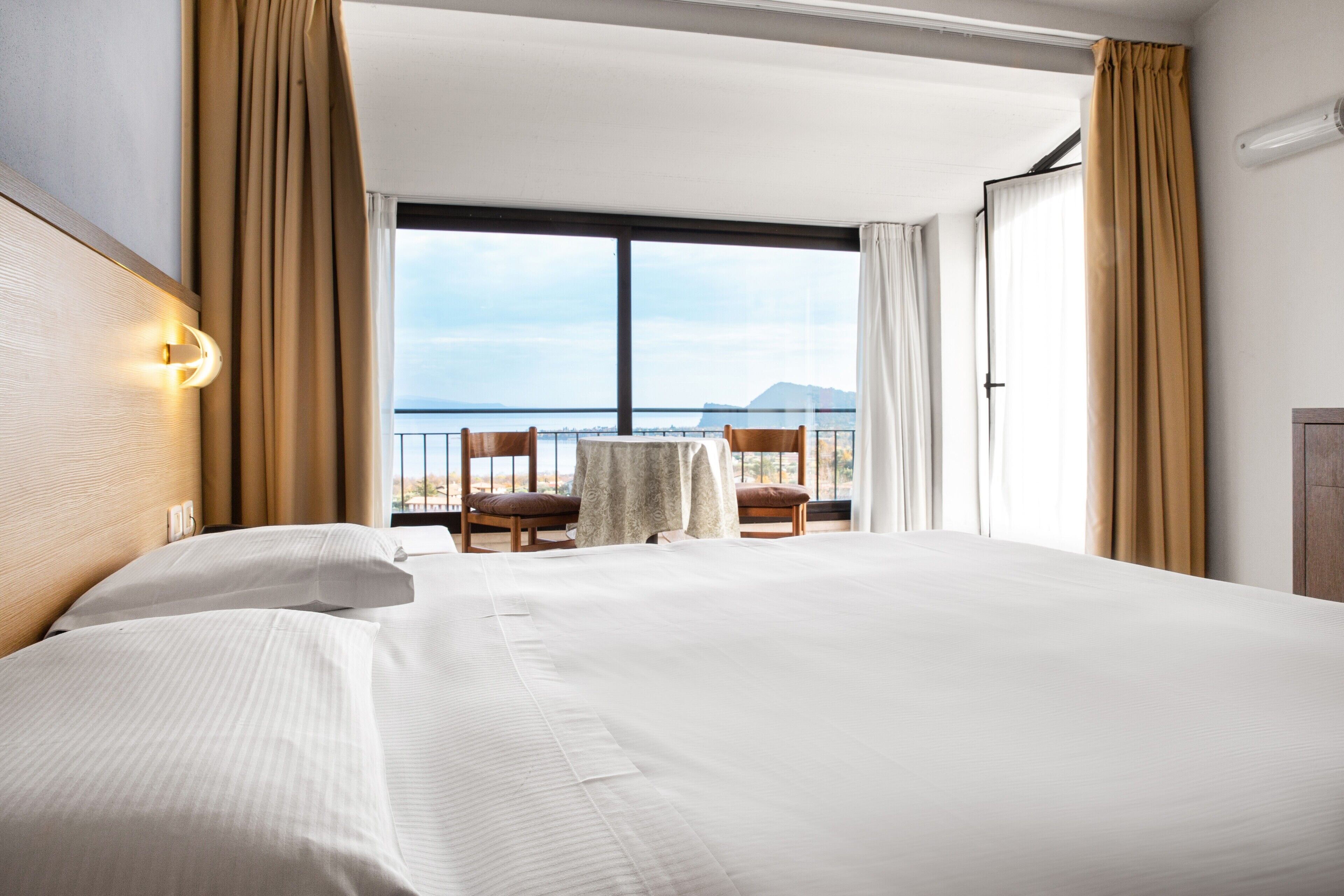 junior studio suite, lake view | 1 bedroom, in-room safe, desk, free wifi