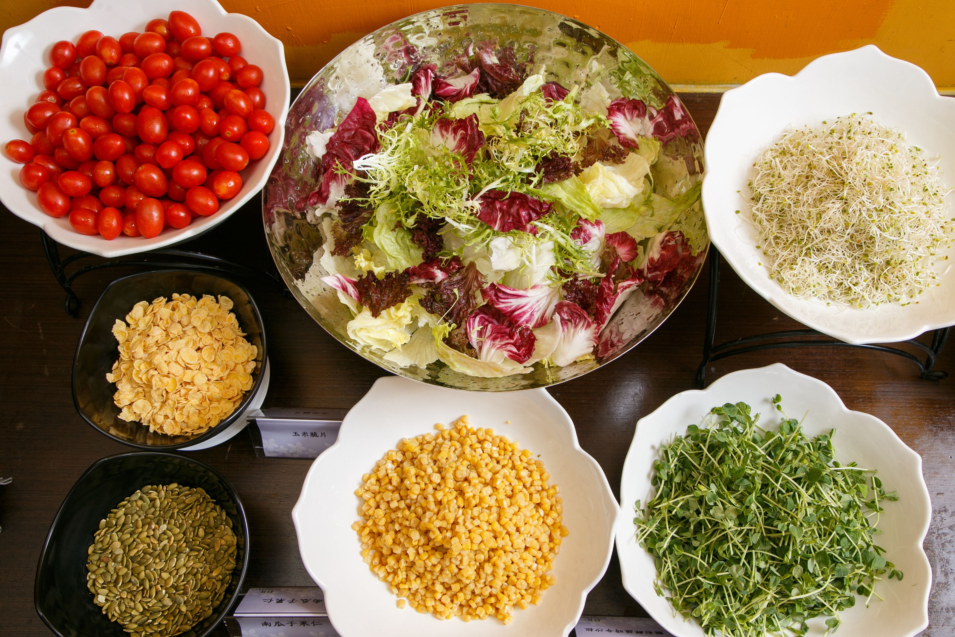 Various food items in bowls on a table.