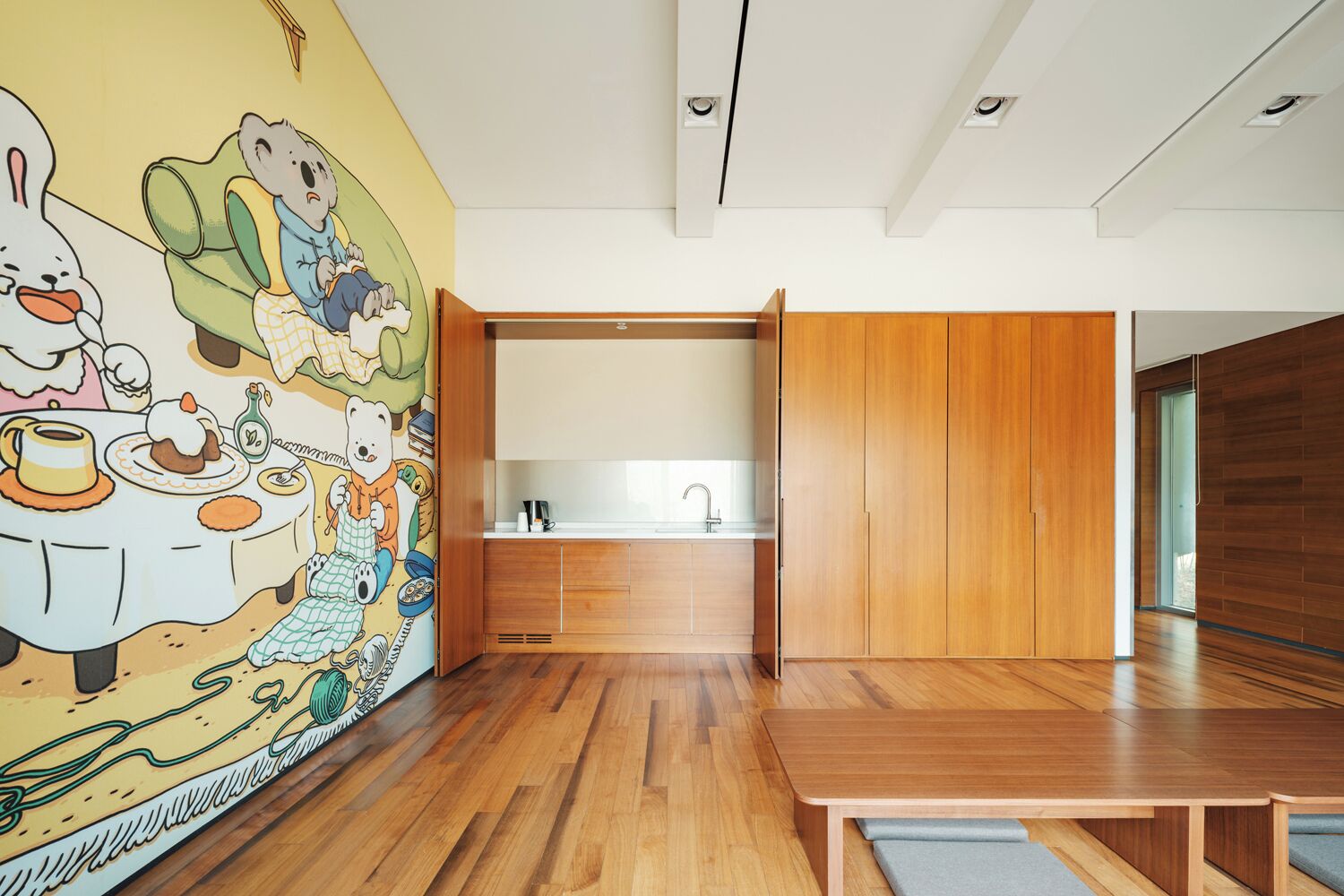 A modern kitchen with wooden cabinets and a built-in sink.