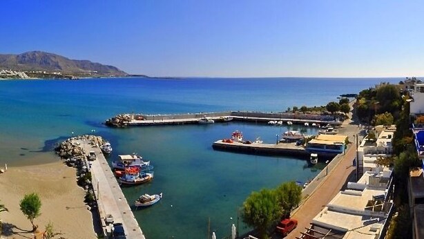 A coastal town with a beach, a pier, and boats. - Cybele Suites & Apartments (Ierapetra)