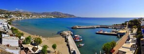A coastal town with a beach, a pier, and boats. - Cybele Suites & Apartments (Ierapetra)