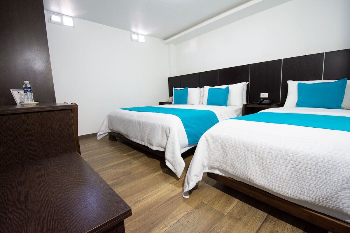 Family Quadruple Room | Down duvets, pillow-top beds, minibar, desk