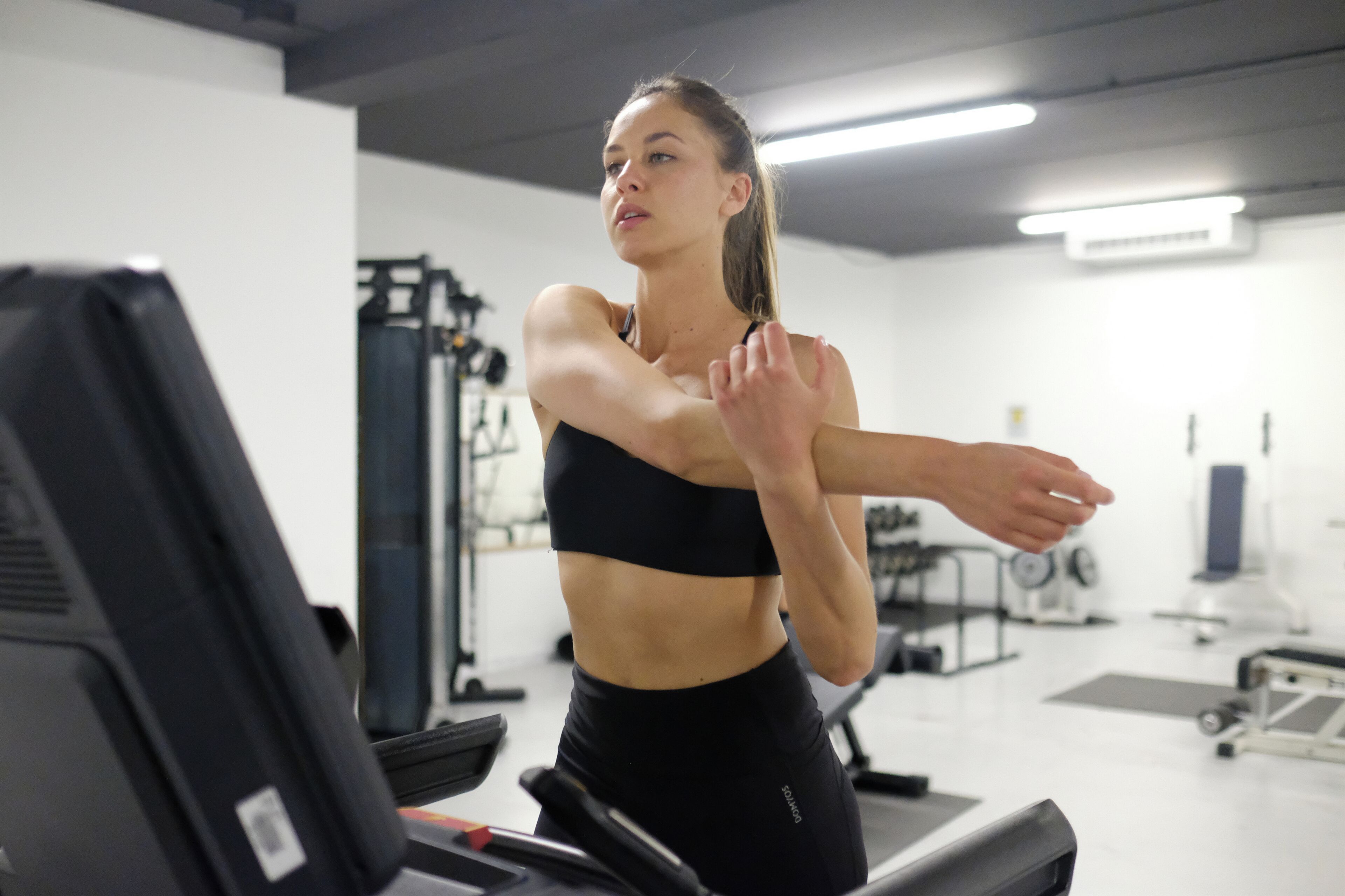 A gym with exercise equipment, including treadmills and weight machines.