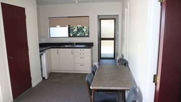 Economy Room, 2 Bedrooms | Private kitchen | Fridge, microwave, electric kettle