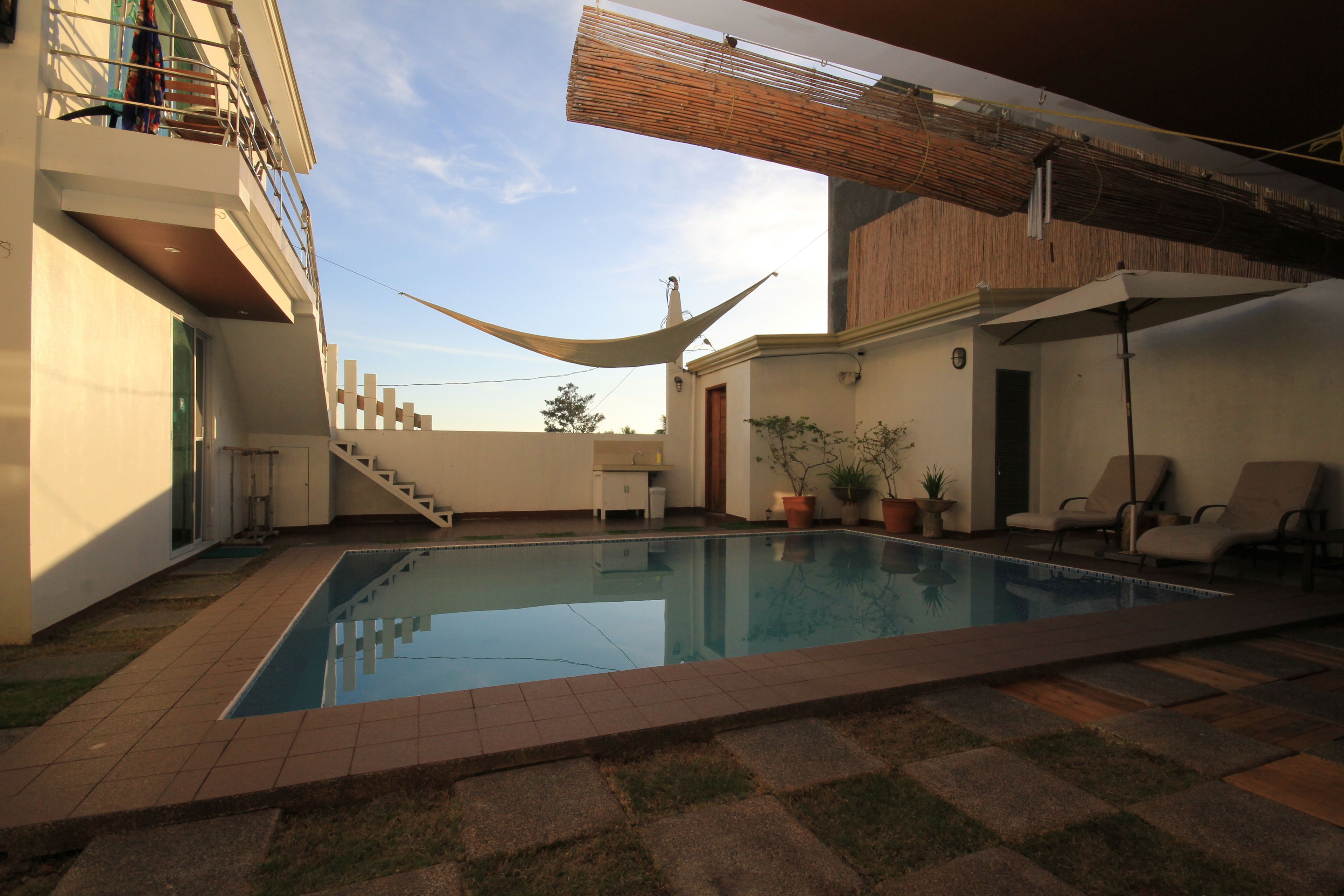 outdoor pool, pool umbrellas, pool loungers