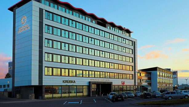 A multi-story hotel with a modern design, featuring a prominent logo on the facade and a clear entrance. - Reykjavik Lights by Keahotels (Reykjavik)