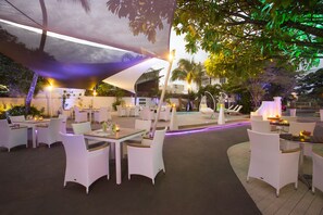 Breakfast, lunch, dinner served; Fusion cuisine, pool views