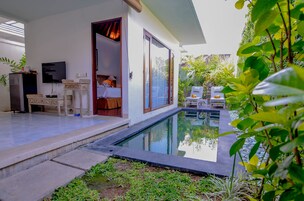 A modern villa with a swimming pool, a bedroom with a large window, and a dining area with a TV.