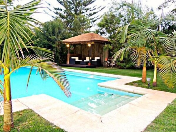 Seasonal outdoor pool, pool umbrellas, pool loungers