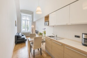 Standard Apartment, 1 Bedroom, Kitchen | Living area | 32-inch flat-screen TV with satellite channels, TV, DVD player - Bohemia Apartments Prague Old Town (Prague)