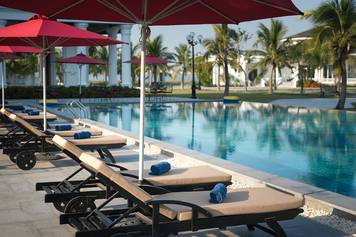 outdoor pool, pool umbrellas, pool loungers
