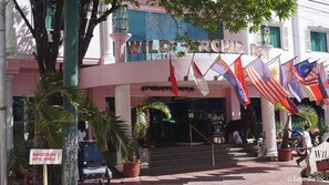 A hotel entrance with a sign reading "WILD ORCHID RESORT". - Wild Orchid Resort (Angeles City)