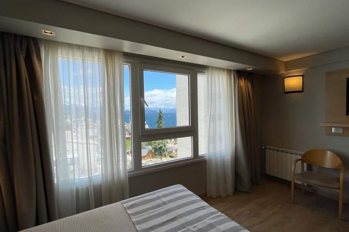 premium room, lake view | minibar, in-room safe, desk, blackout curtains