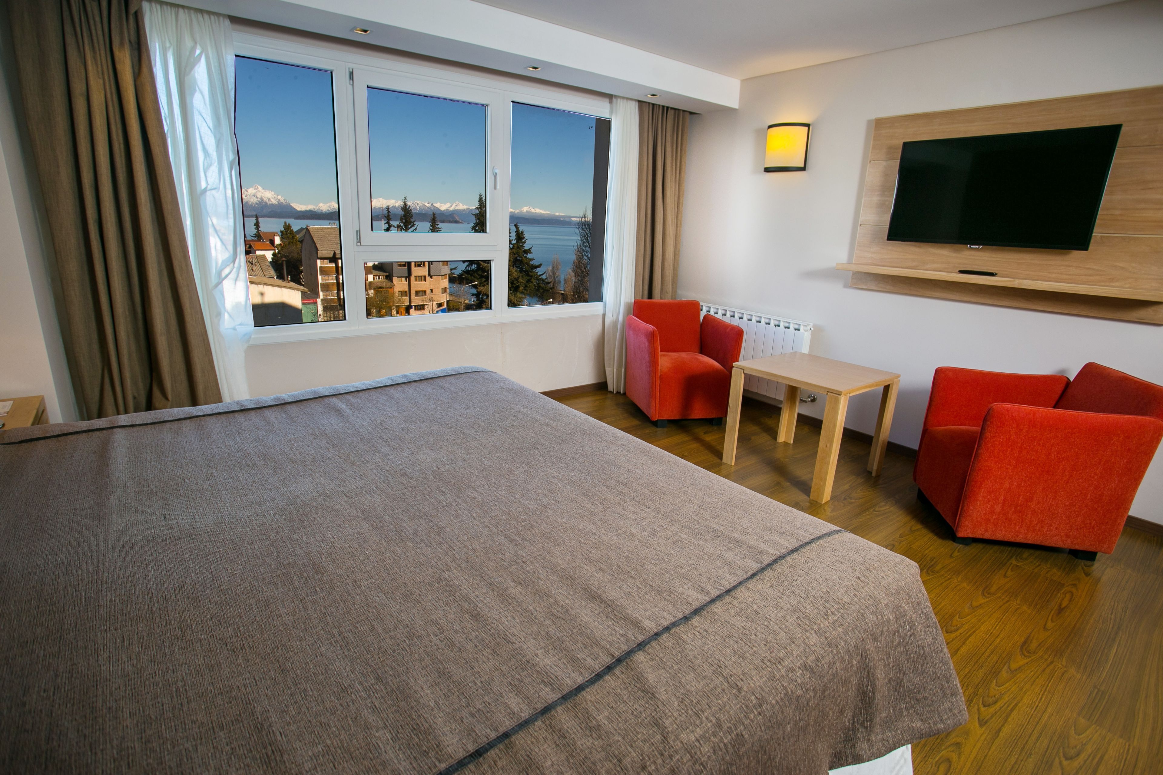 premium room, lake view | minibar, in-room safe, desk, blackout curtains