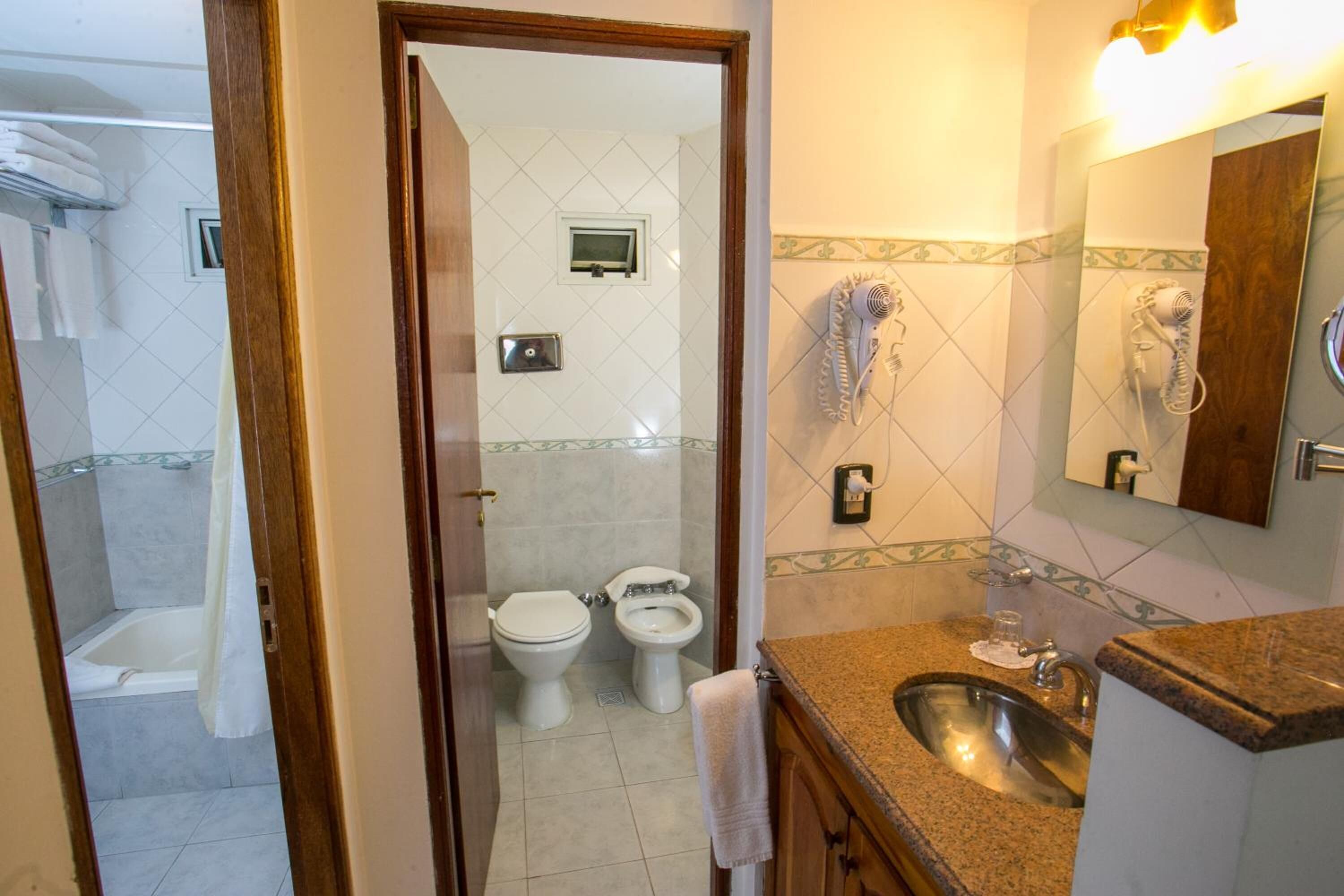 combined shower/bathtub, deep-soaking bathtub, hair dryer, bidet