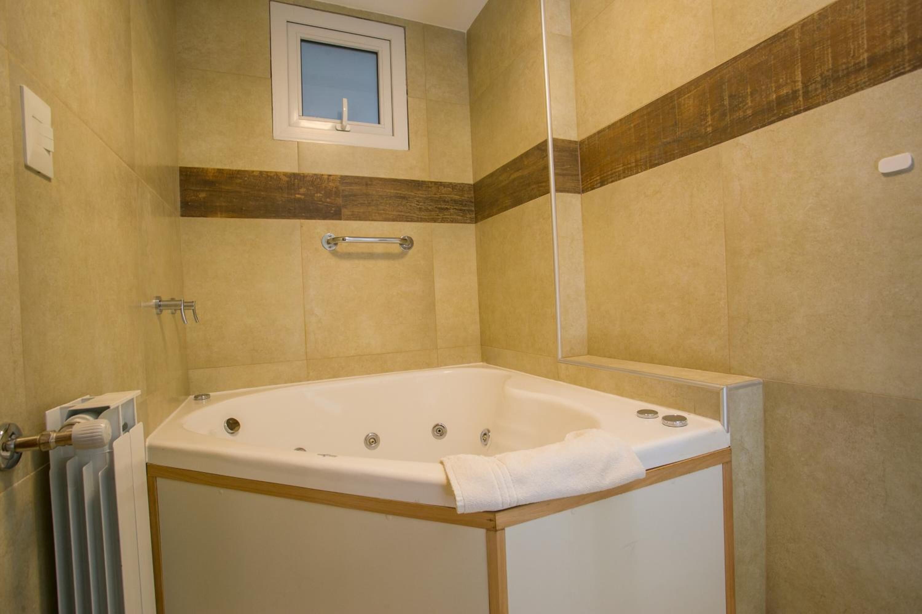 combined shower/bathtub, deep-soaking bathtub, hair dryer, bidet