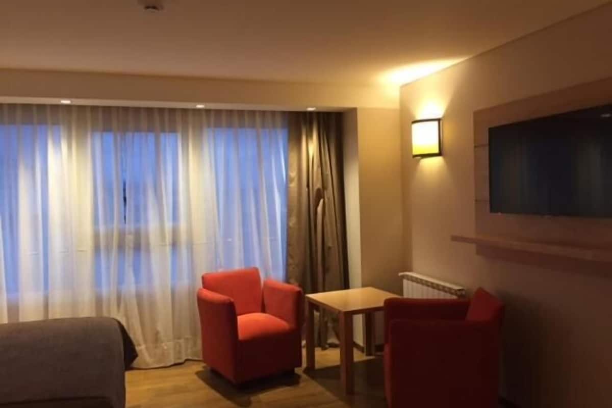 premium room, lake view | living room | 32-inch lcd tv with cable channels, tv, dvd player