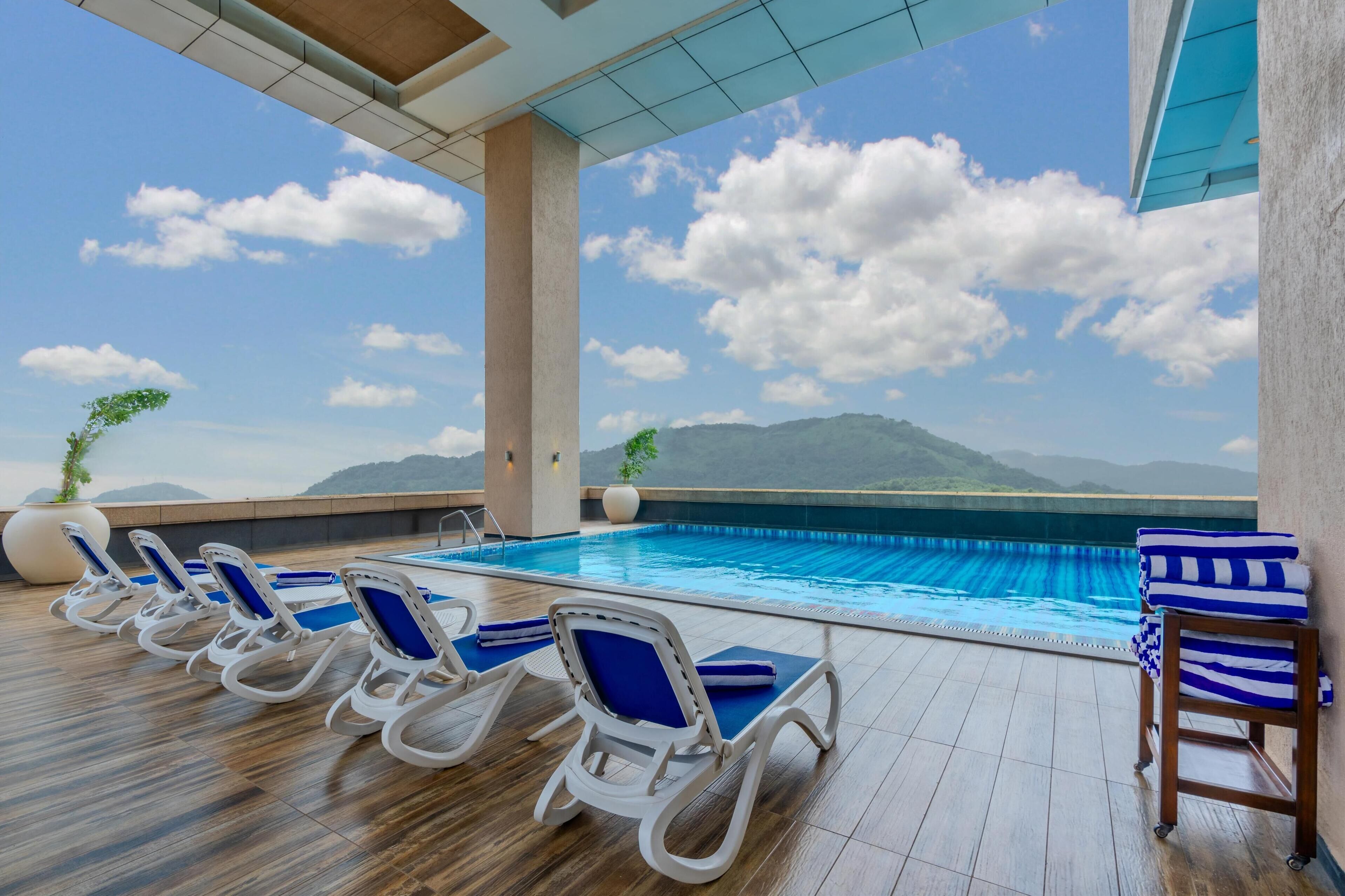 Outdoor pool, open 7:00 AM to 7:00 PM, sun loungers