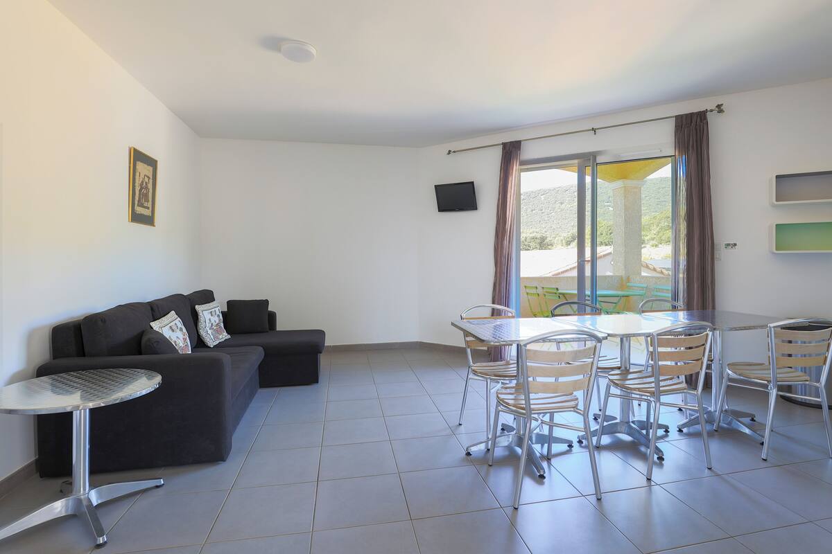 Apartment, Multiple Beds | Living area | Flat-screen TV