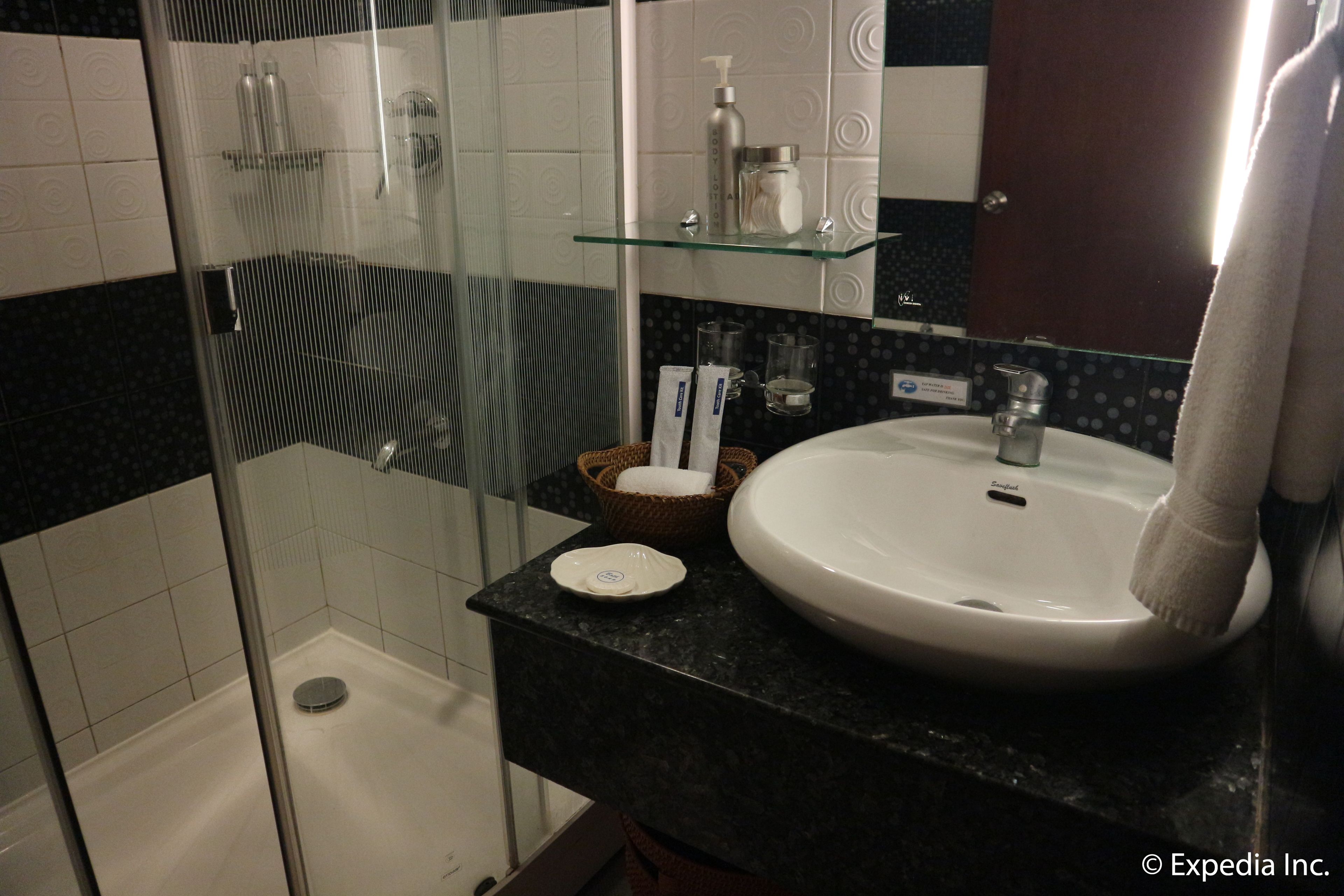 superior room | bathroom | shower, hair dryer, slippers, towels