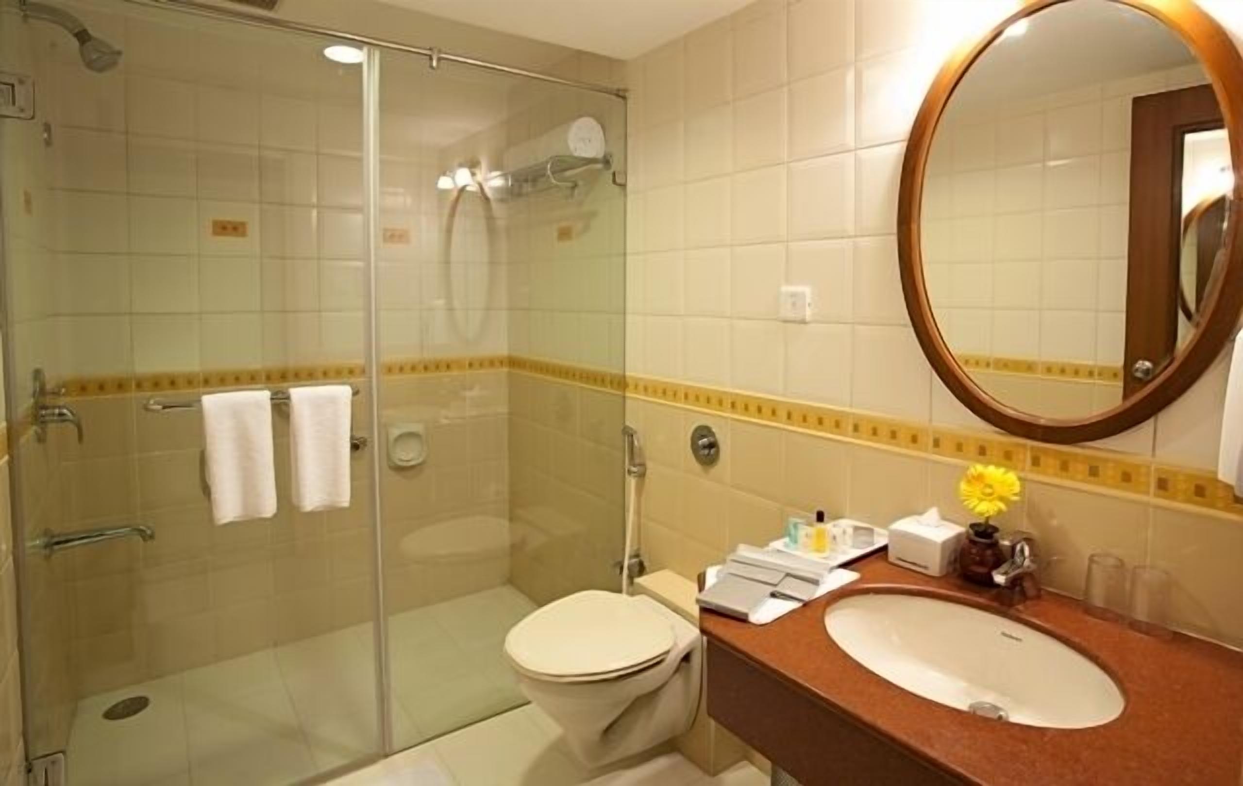 club suite | bathroom | rainfall showerhead, free toiletries, hair dryer, bathrobes