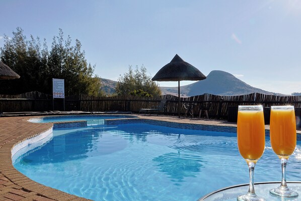 Outdoor pool, pool umbrellas, pool loungers