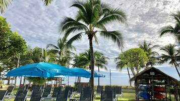 On the beach, white sand, sun-loungers, beach umbrellas
