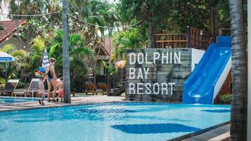 Relax by the pool at Dolphin Bay Resort, surrounded by comfortable lounge chairs and a spacious deck.