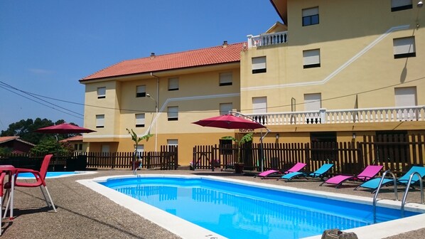 Outdoor pool, pool umbrellas, pool loungers