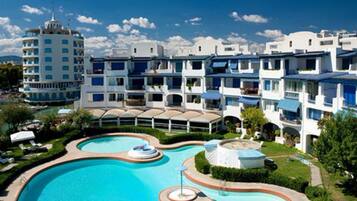 Seasonal outdoor pool, pool umbrellas, pool loungers