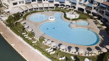 Seasonal outdoor pool, pool umbrellas, pool loungers