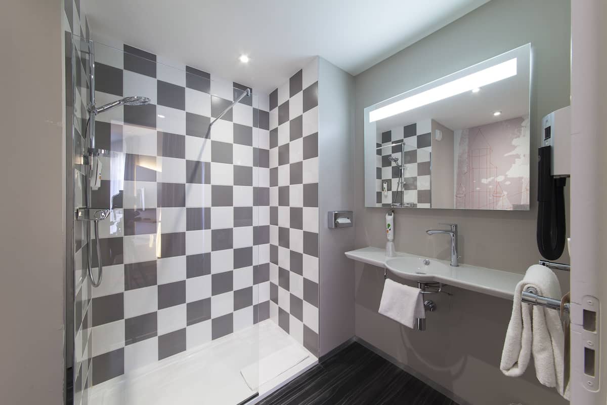 standard double room, 1 double bed with sofa bed | bathroom | shower, eco-friendly toiletries, hair dryer, towels