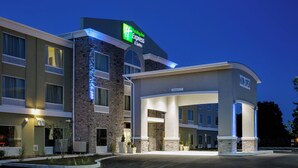 A Holiday Inn Express & Suites hotel with a stone facade and a clear entrance. - Holiday Inn Express Hotel & Suites, Carlisle-Harrisburg Area by IHG (Carlisle)