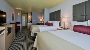 A hotel room with two beds, a desk, a television, and a kitchenette. - Holiday Inn Express Hotel & Suites, Carlisle-Harrisburg Area by IHG (Carlisle)